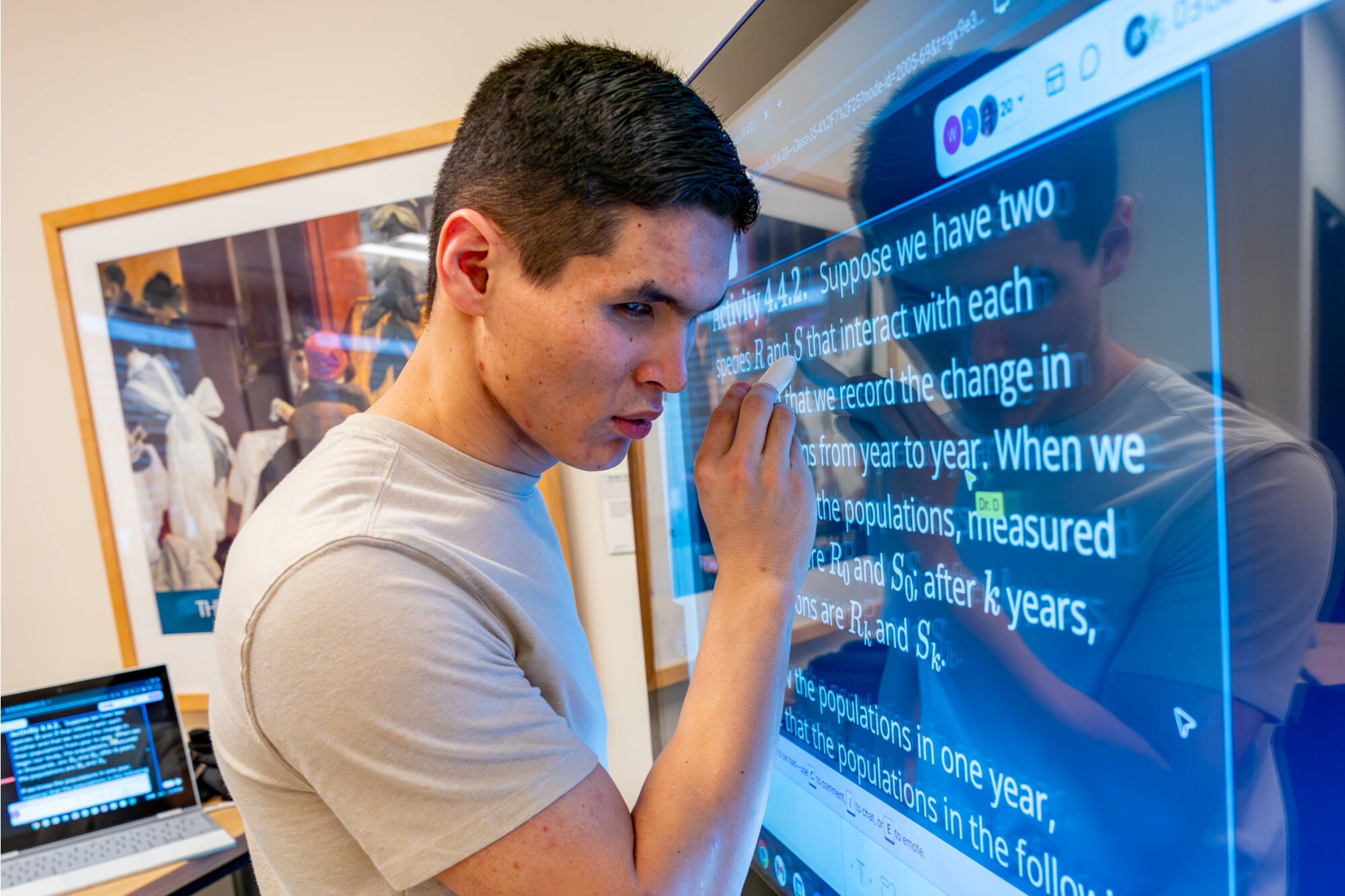 Computer science major Shamurat "Shon" Raimbekov works in MTH 204 - Linear Algebra I at Mackinac Hall on April 7. Raimbekov is a blind student.
